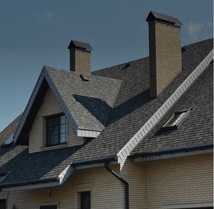 House with multiple chimneys and gabled roof.